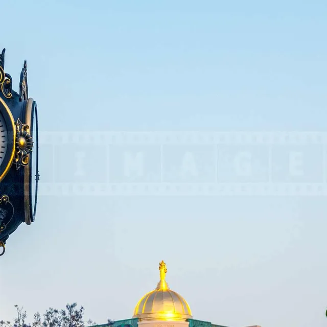A Graceful Clock with the sign The Americana