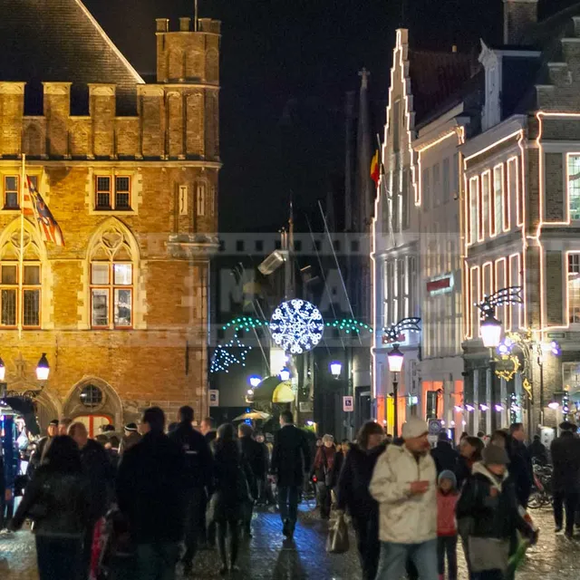Medieval building and street vendors in the Market square