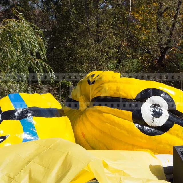 three large pumpkins made into floating boats on display during parade