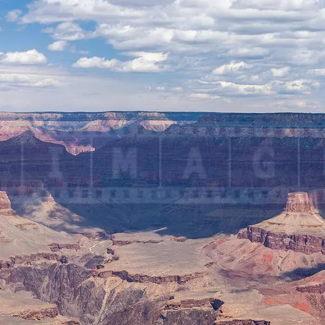 tourists at the lookout point over the Grand Canyon