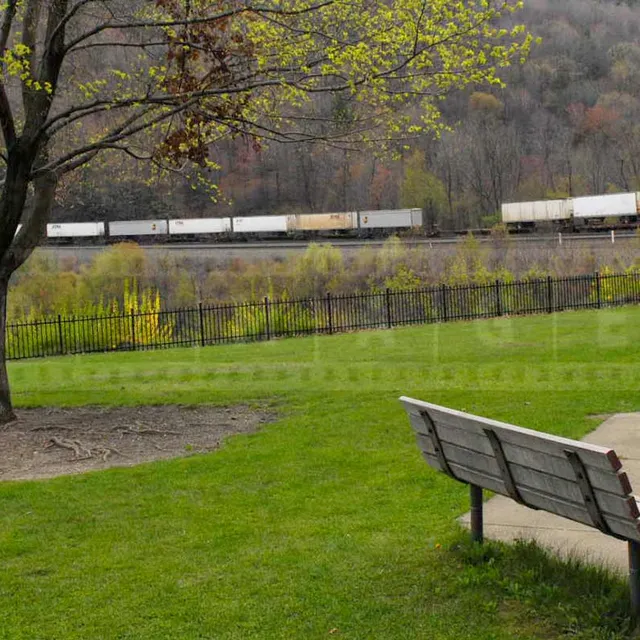 beautiful park with benches to observe trains