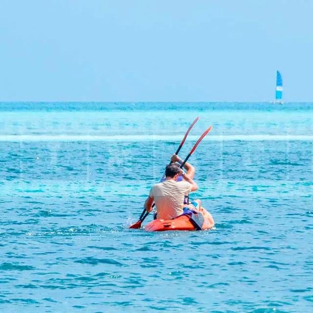 People enjoying kayak at Iberostar Daiquiri beach cuba