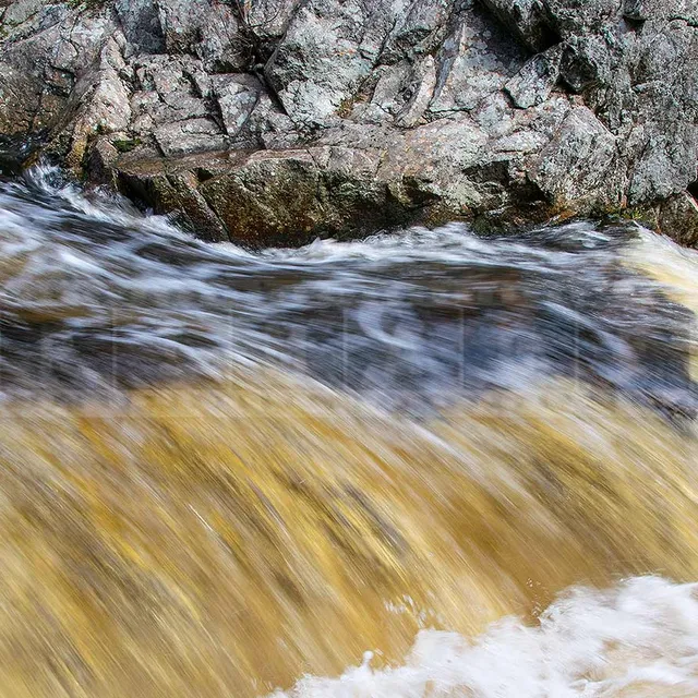 fast moving water at Millet Falls waterfall