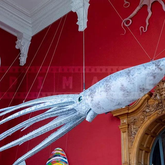 Giant squid model hanging from the ceiling at the museum