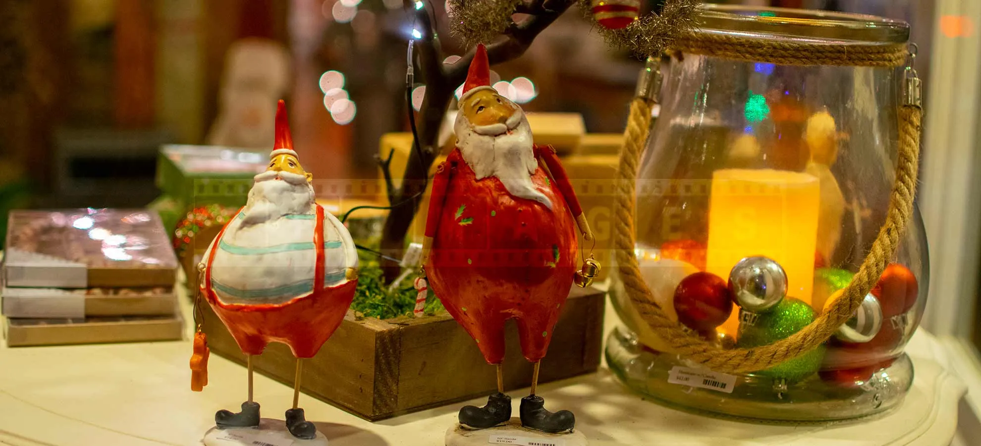 Retro style Santa's figurines in the window display