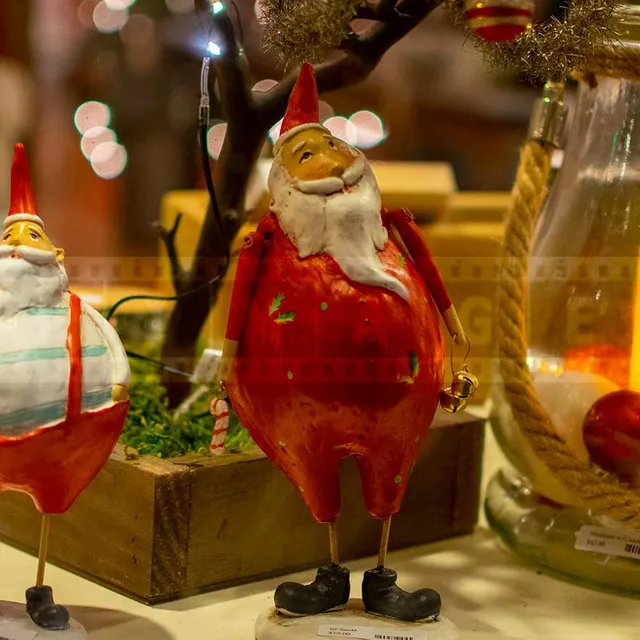 Retro style Santa's figurines in the window display