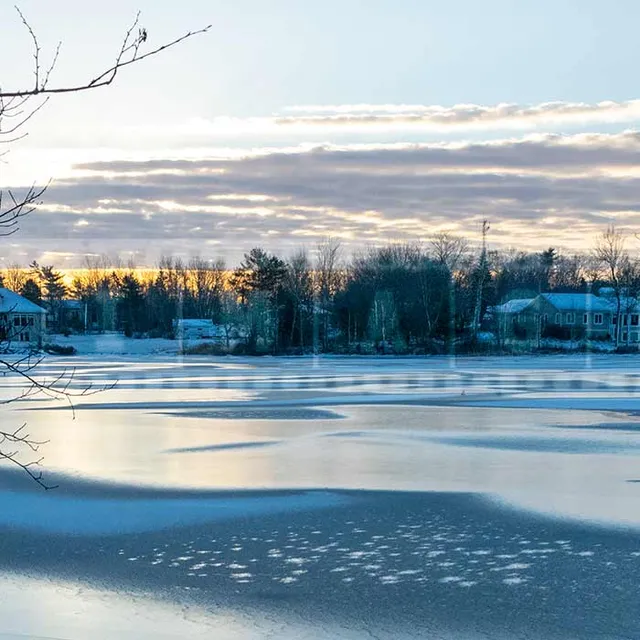 Winter scene - sunrise above frozen lake in Sackville, NS, Canada
