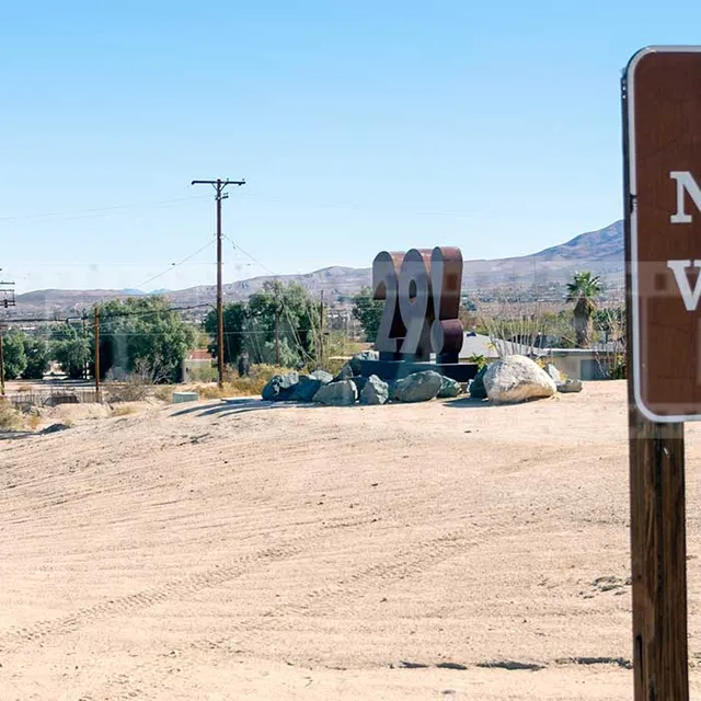 Road sign to Joshua national park and oasis of mara